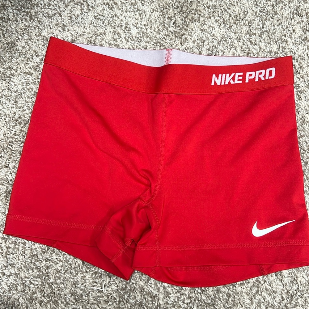 Red women’s Nike dri fit spandex shorts